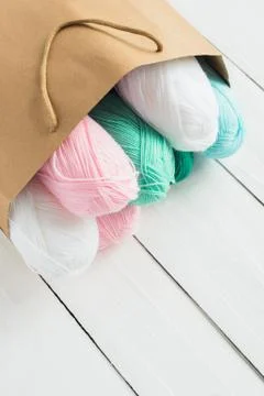 Oval acrylic wool yarn thread skeins with kraft package Stock Photos