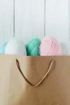 Oval acrylic wool yarn thread skeins with kraft package Stock Photos