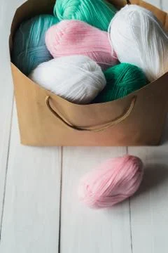 Oval acrylic wool yarn thread skeins with kraft package Stock Photos