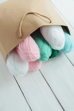 Oval acrylic wool yarn thread skeins with kraft package Stock Photos