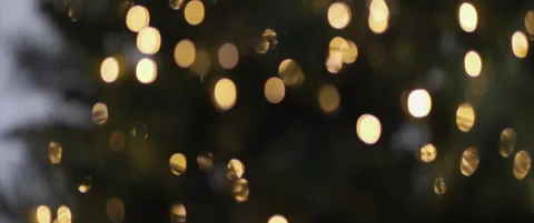 Oval bokeh of Christmas tree lights 4K scope video Stock Footage 324012352