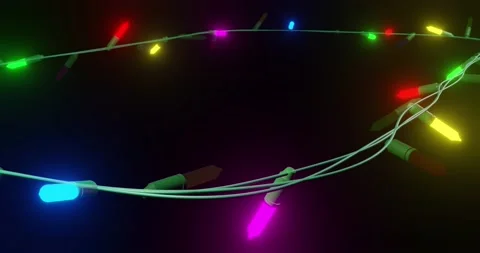 Oval of coloured christmas string lights flashing on black background, copy Stock Footage 253158423