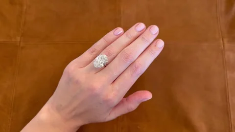 Oval diamond platinum ring with suede background, landscape video. Stock Footage 316747572