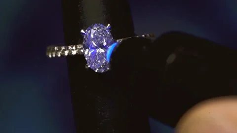 Oval Diamond Ring On Mandrel Under UV Light. - close up Vidéo 229038241