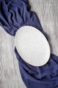Oval light dish on light gray table Fotos de archivo