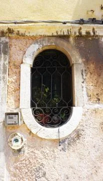 Oval shape window of old house Stock Photos