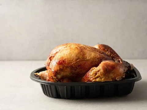 Oven-baked chicken on a plate Stock Photos