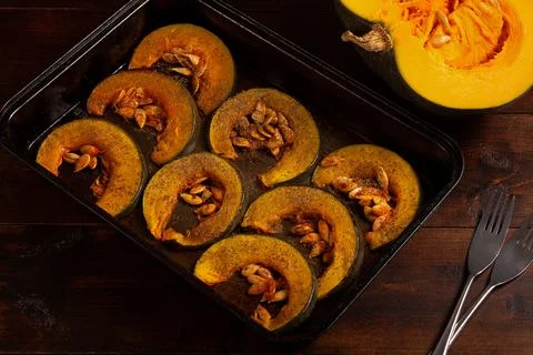 Oven-baked pumpkins on a baking sheet top vew. The concept of healthy eating Stock Photos