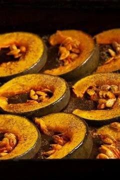 Oven-baked pumpkins on a baking sheet top vew. The concept of healthy eating. Stock Photos