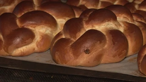 The oven in the bakery. Hot fresh bread leaves the industrial oven in a bakery.  Stock Footage 169050292