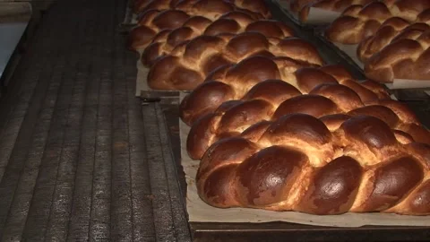 The oven in the bakery. Hot fresh bread leaves the industrial oven in a bakery.  Stock Footage 169050310