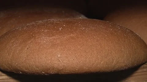 The oven in the bakery. Hot fresh bread leaves the industrial oven in a bakery.  Stock Footage 169050343