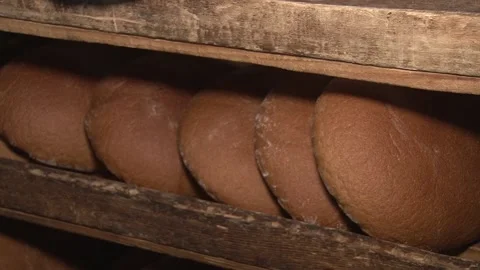 The oven in the bakery. Hot fresh bread leaves the industrial oven in a bakery.  Stock Footage 169050345