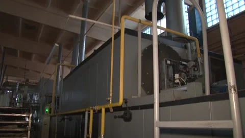 The oven in the bakery. Hot fresh bread leaves the industrial oven in a bakery.  Stock Footage 169050348