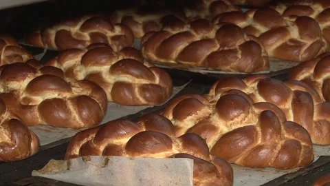 The oven in the bakery. Hot fresh bread leaves the industrial oven in a bakery.  Stock Footage 169050387