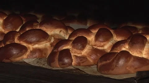 The oven in the bakery. Hot fresh bread leaves the industrial oven in a bakery.  Stock Footage 169051358