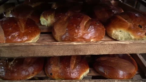 The oven in the bakery. Hot fresh bread leaves the industrial oven in a bakery. Stock Footage 223910535