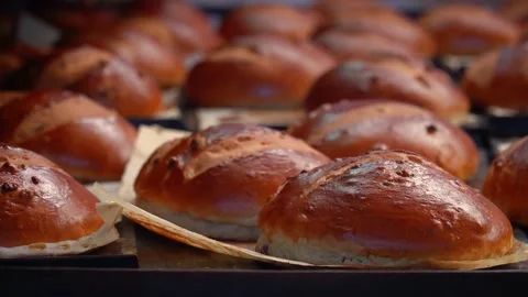 The oven in the bakery. Hot fresh bread leaves the industrial oven in a bakery. Stock Footage 223911806