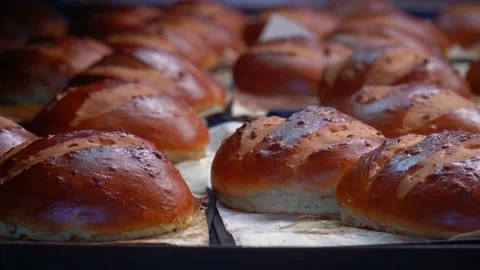 The oven in the bakery. Hot fresh bread leaves the industrial oven in a bakery. Stock Footage 223912201