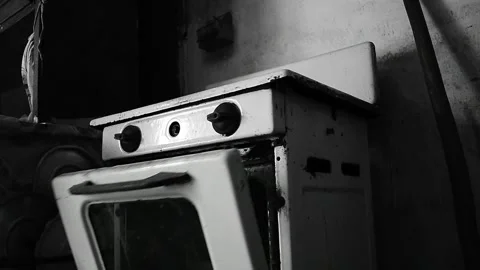 Oven door of the gas stove opens itself Stock Footage