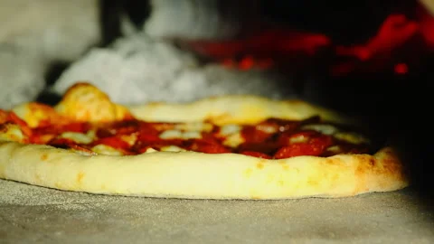 Oven heat penetrates dough causing color change at edges of pizza Stock Footage 326370253