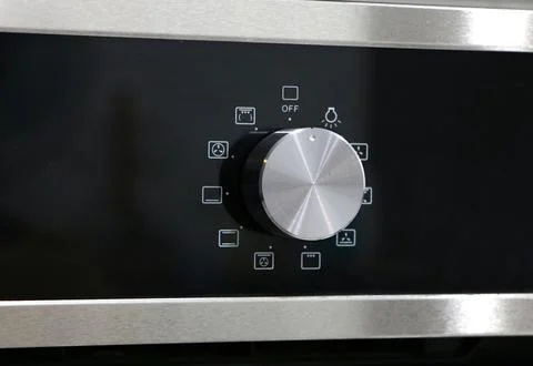 Oven knob controller with multi-function settings Stock Photos
