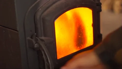 In the oven put the wood Stock Footage 73313508