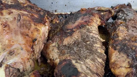 Oven roasted lamb legs slowly cooking Video stock 344099986