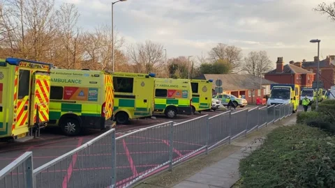 Over 30 ambulances queue at a Hospital Accident and Emergency department Stock Footage 227385975