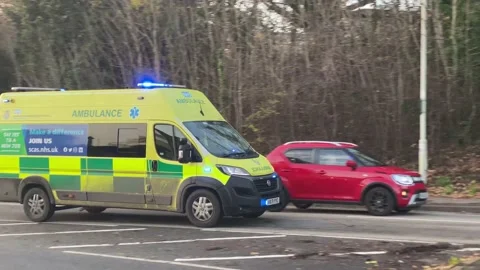 Over 30 ambulances queue at a Hospital Accident and Emergency department Stock Footage 227386061