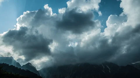 Over 4K Time Lpase - Clouds over Mountain Stock Footage