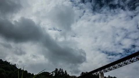 Over 5K Time Lpase - Clouds over bridge Stockbeeldmateriaal 62558323