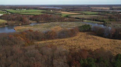 Over autumn farmland east of Chesapeake Bay, Maryland. Shot in November 2011. Stock Footage 59215068