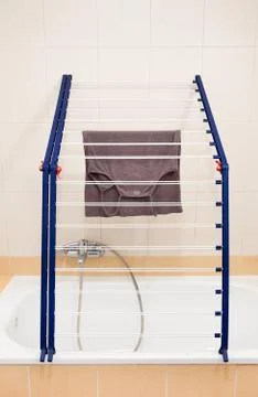 Over bath folding blue clothes horse Stock Photos