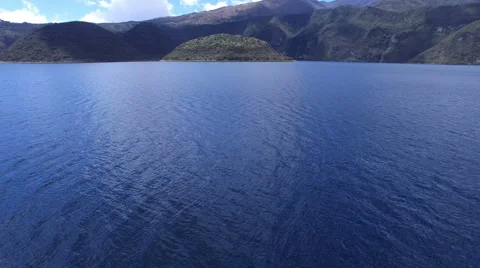 Over the Blue Waters of Facing the Volcanic Lake Cuicocha in the Andes Video stock 67321747