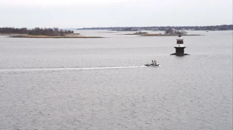 Over boat passing Cockenoe Harbor lighthouse near Bridgeport, Connecticut. Shot Stock Footage 59170004