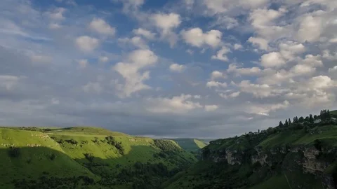 Over canyon slowly floating clouds 動画素材 78487589