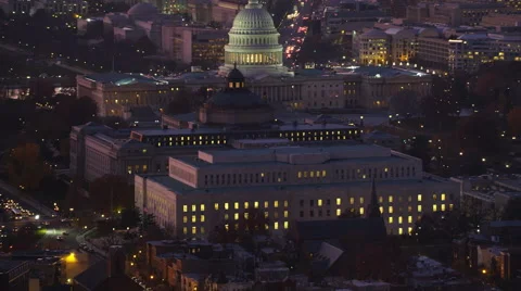Over Capitol Hill, past Capitol, Library of Congress, and Office of Compliance; Vídeo Stock 59191132