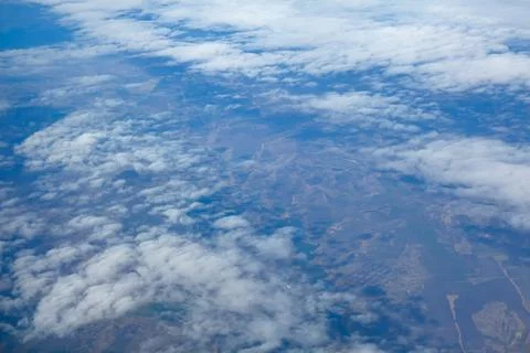 Over the clouds and earth Stock Photos