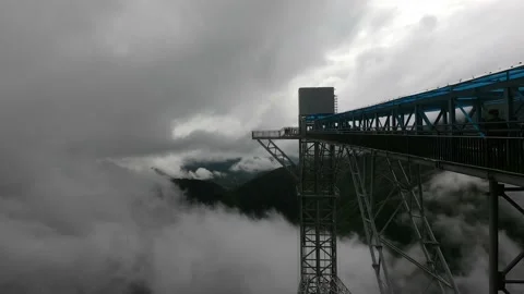 Over the clouds bridge time lapse in the mountains. Time lapse Stock Footage 155827176