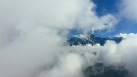 Over the Clouds. Fantastic background with clouds and mountain peaks. Video stock 203852886