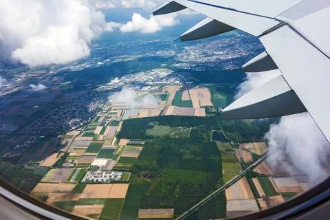 Over the clouds, fields and forest Stock Photos