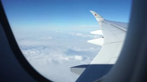 Over the clouds View from airplane window Stock Footage 168740063