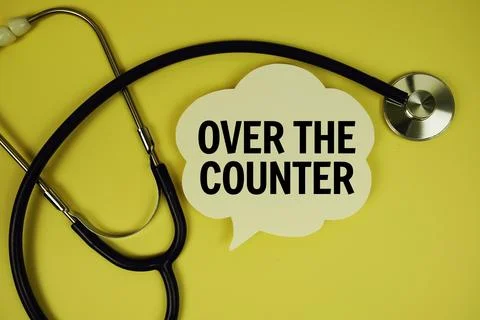 Over The Counter text on speech bubble with stethoscope on yellow backgroun.. Stock Photos