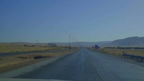 Over the dashboard view of car driving on highway Stock Footage 103330448