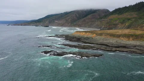 Over the eroded coast of California Stock Footage 152800339