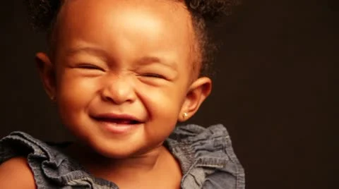 The over excitement of an African baby girl Stock Footage
