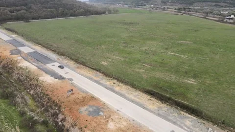 Over Fields and Roads: A Scenic Aerial Journey Video stock 305667700