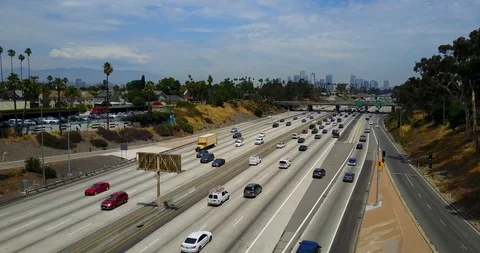 Over freeway highway to city Stock Footage 114031850