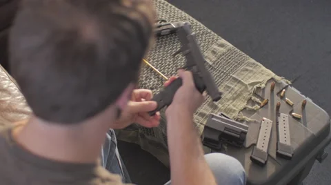 Over Head Cleaning .45 Caliber Semi-Automatic Gun Stock Footage 60665350